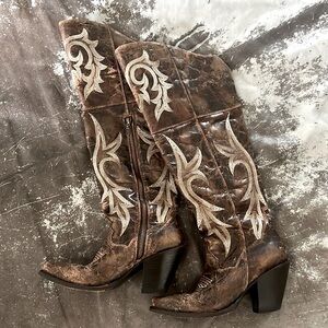 Dan Post Knee high distressed cowgirl boots.